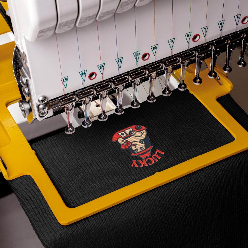 Embroidery machine with a logo on a black mat
