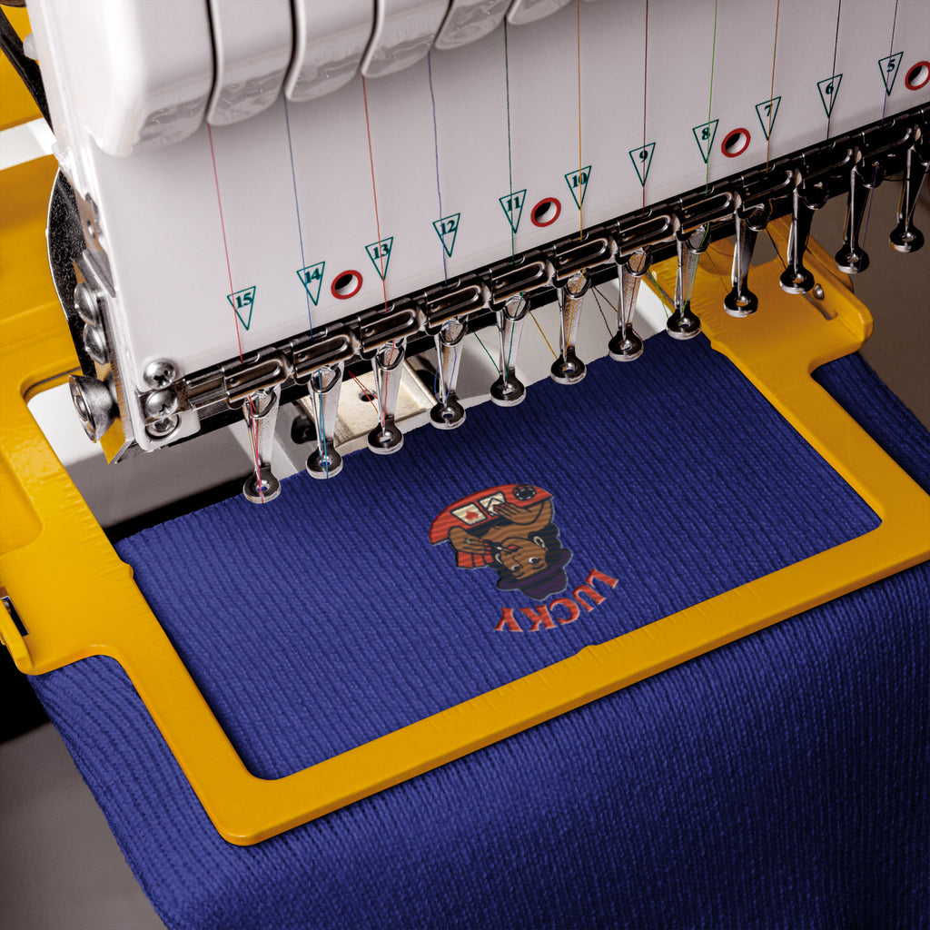 Embroidery machine with a blue hoop featuring a logo being embroidered.