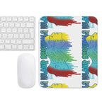 Colorful laptop skin with abstract designs and text on a white surface with keyboard and mouse.