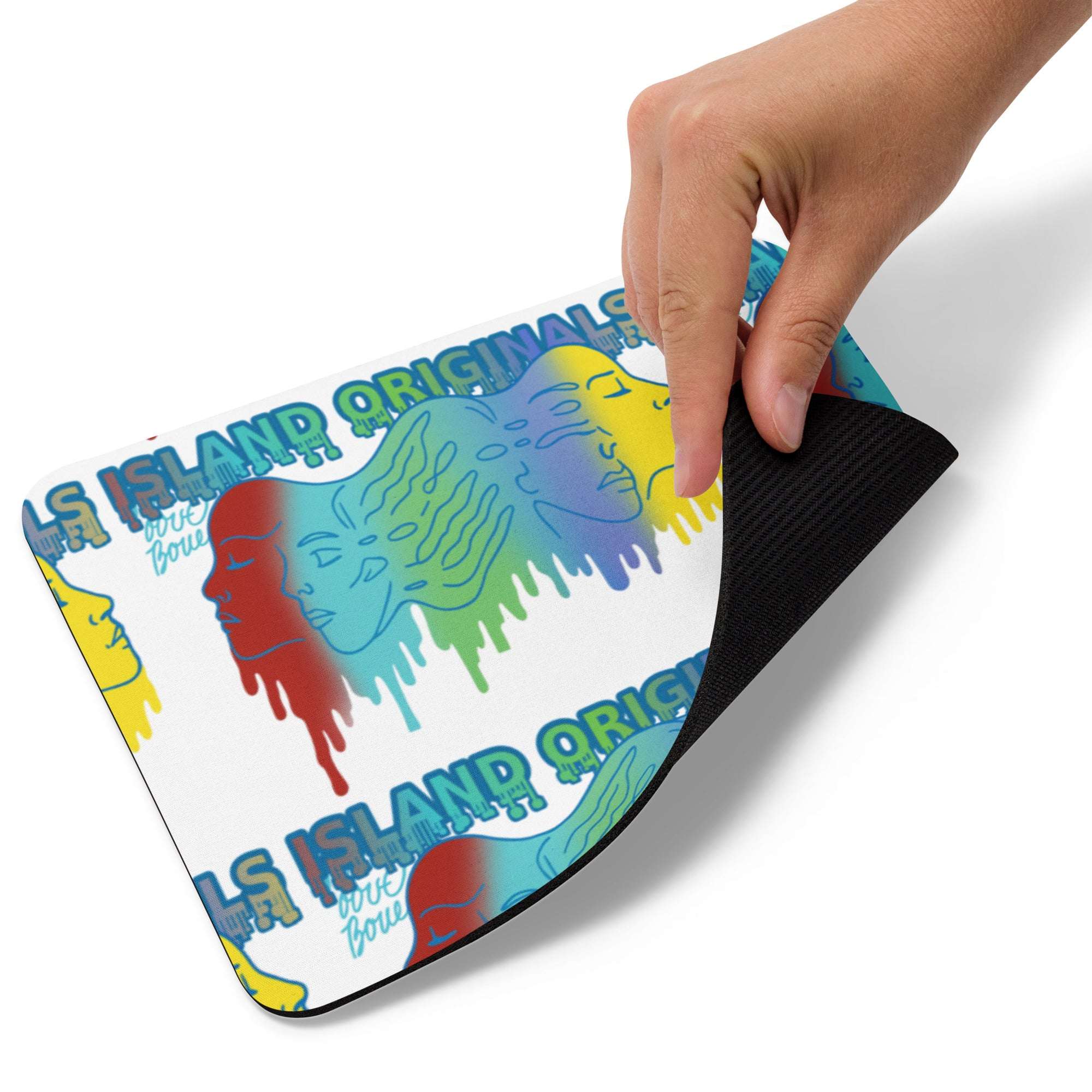 Colorful mouse pad with artistic design and text, held by a hand.