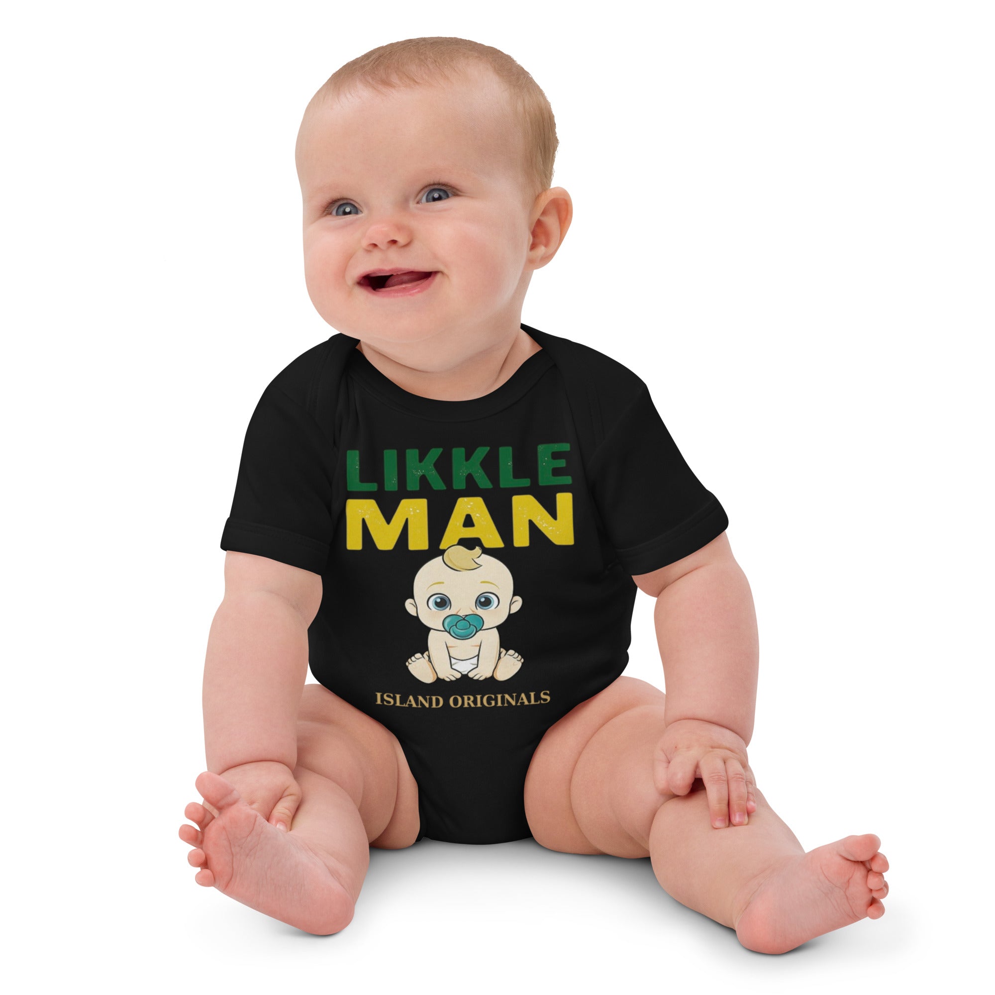 Baby wearing a black onesie with 'Likkle Man' text and graphic on a white background