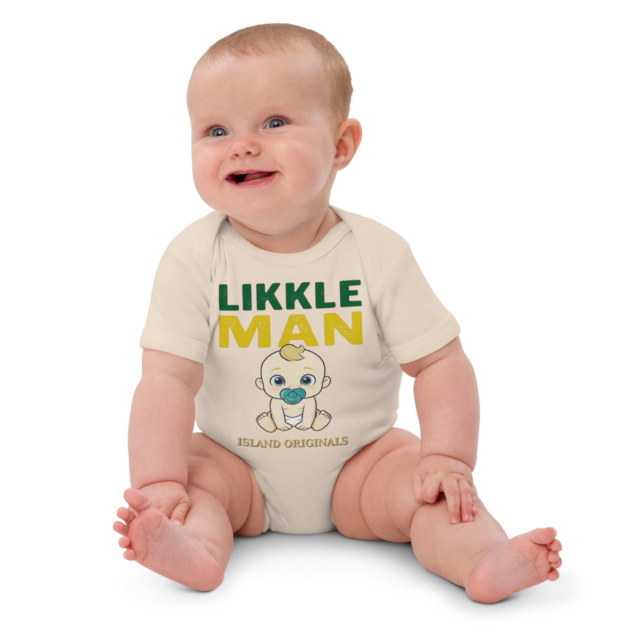Baby wearing a 'Likkle Man' onesie on a white background