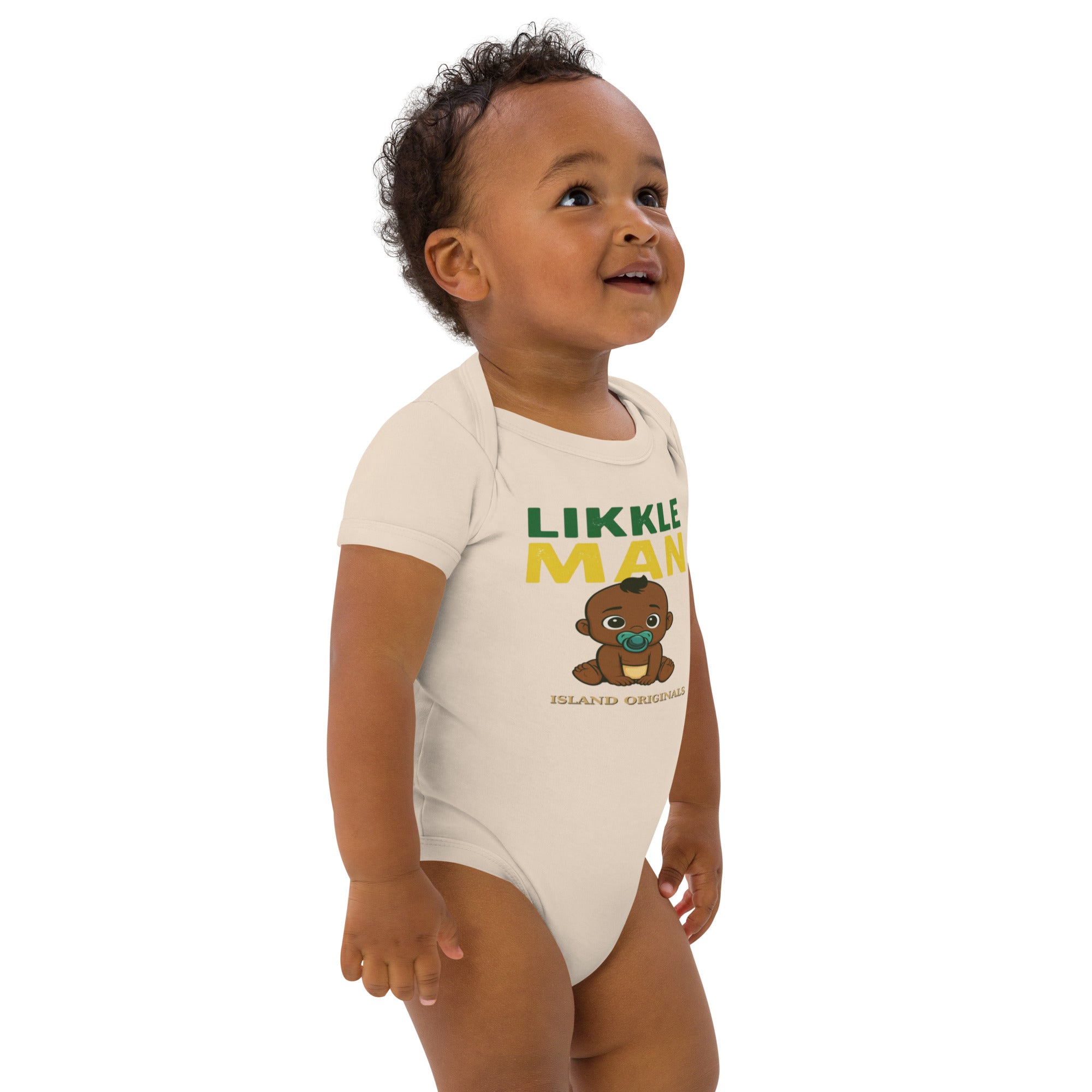 Baby wearing a 'Likkle Man' onesie on a white background