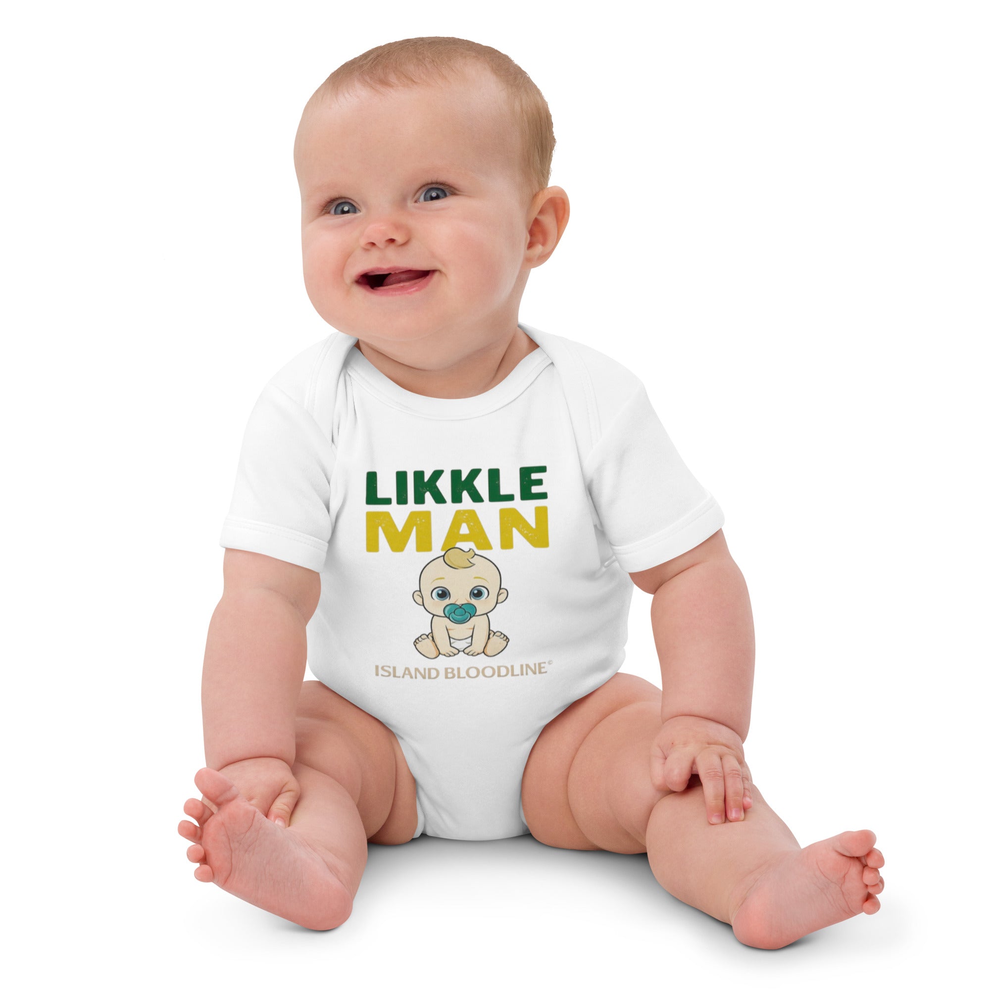 Baby wearing a white onesie with 'Likkle Man' text and graphic on a white background