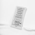 Clothing label with text and logos on a white background