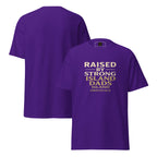 Purple t-shirt with text 'Raised by Strong Island Dads' on a white background
