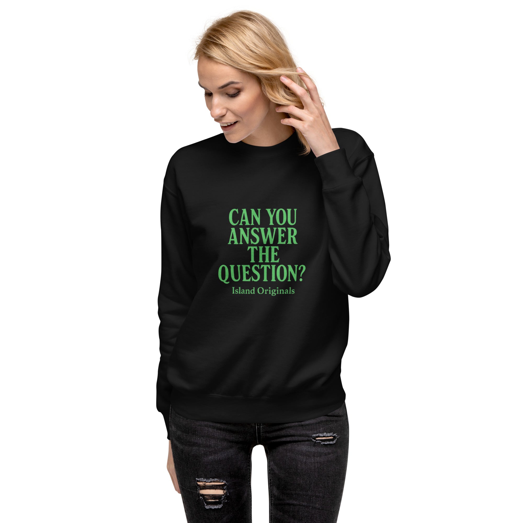 Person wearing a black sweatshirt with green text on a white background