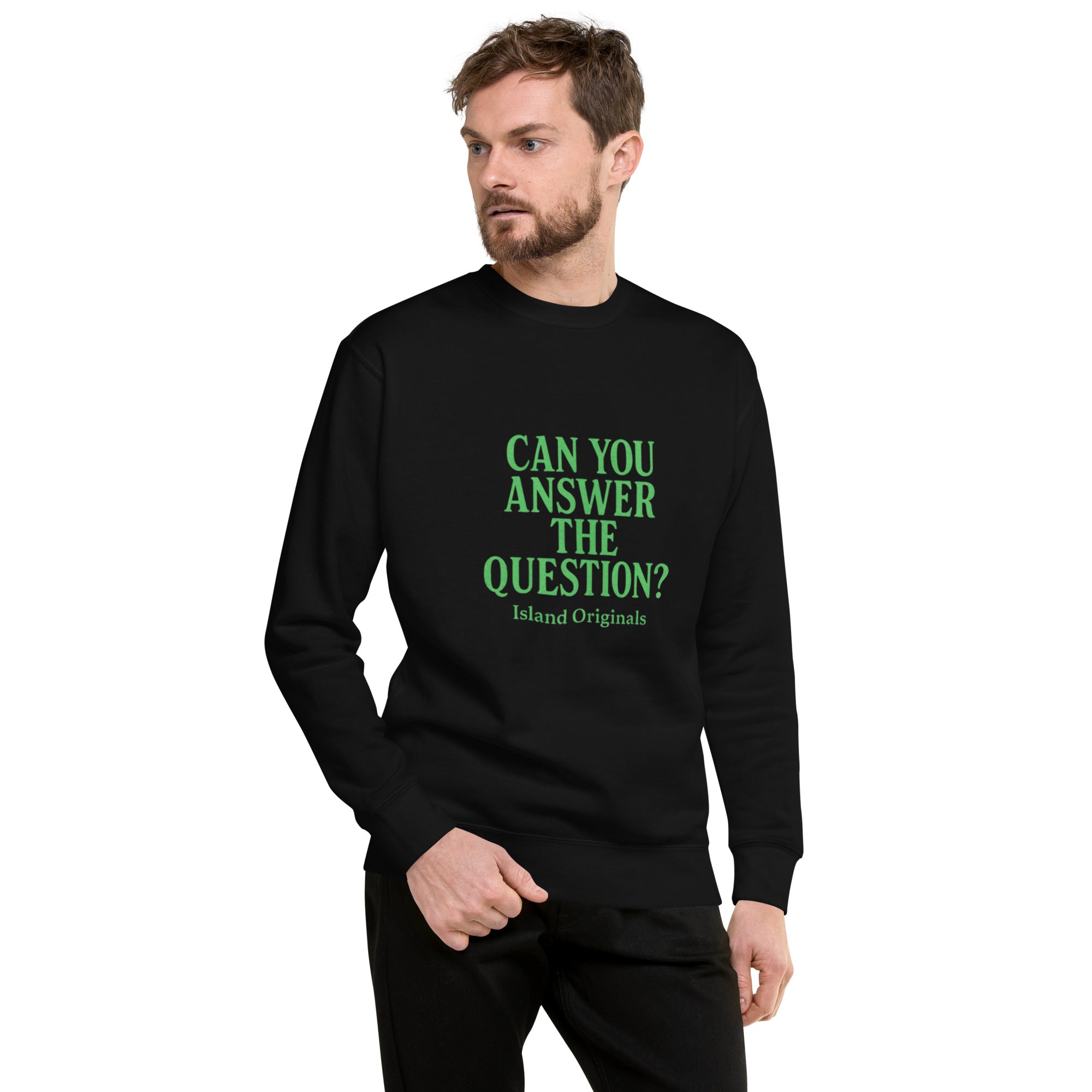 Man wearing a black sweatshirt with green text on a white background