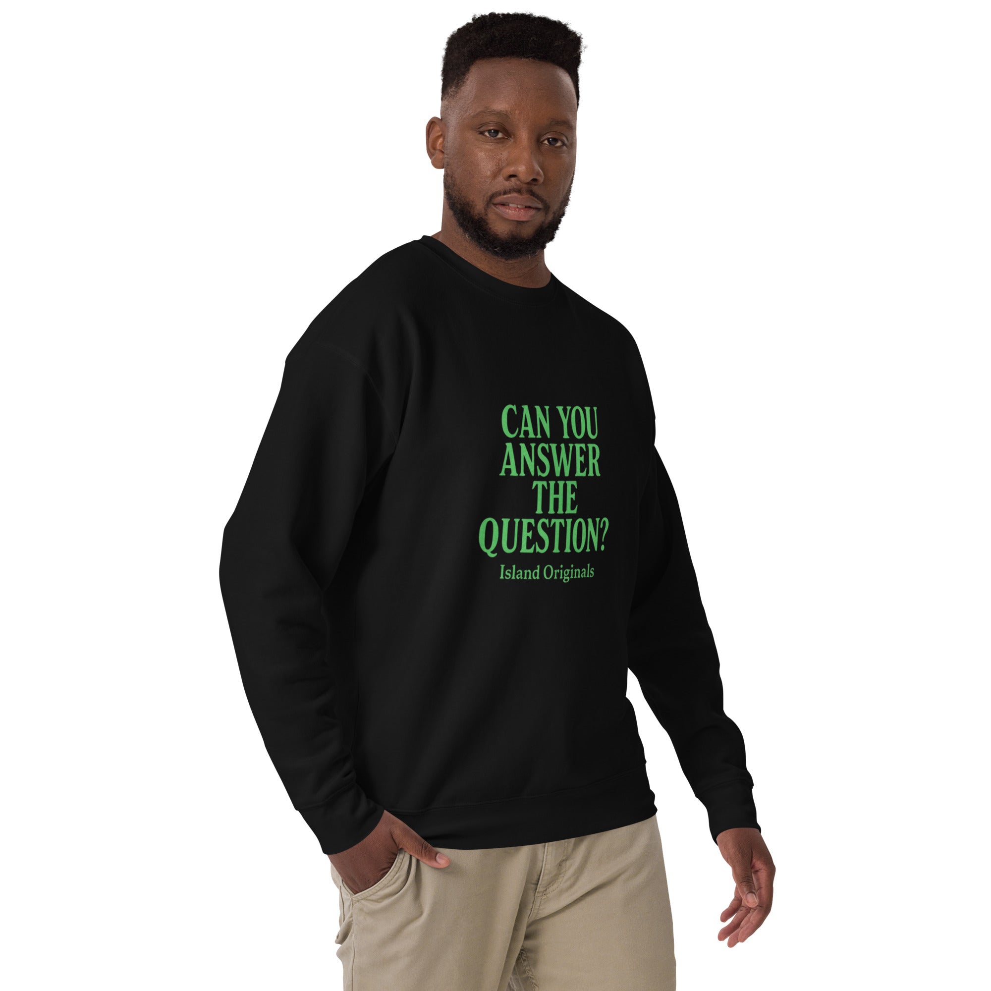Man wearing a black sweatshirt with green text on a white background