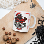 White mug with a festive design on a wooden surface with nuts and decorative items.
