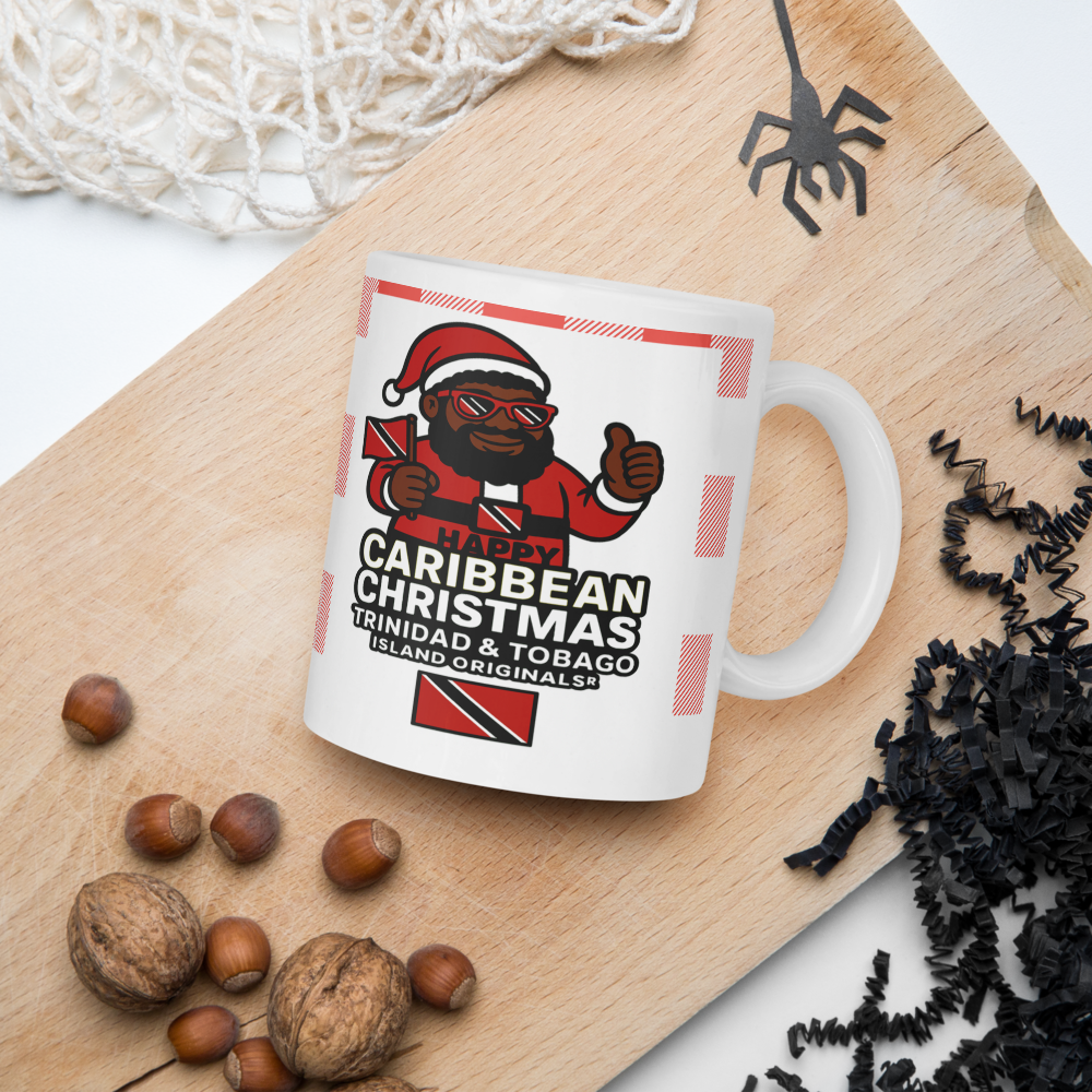 White mug with a festive design on a wooden surface with nuts and decorative items.