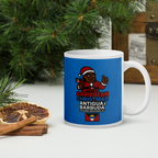 Mug with Caribbean Christmas design featuring a character in a Santa hat, placed on a surface with decorative elements.
