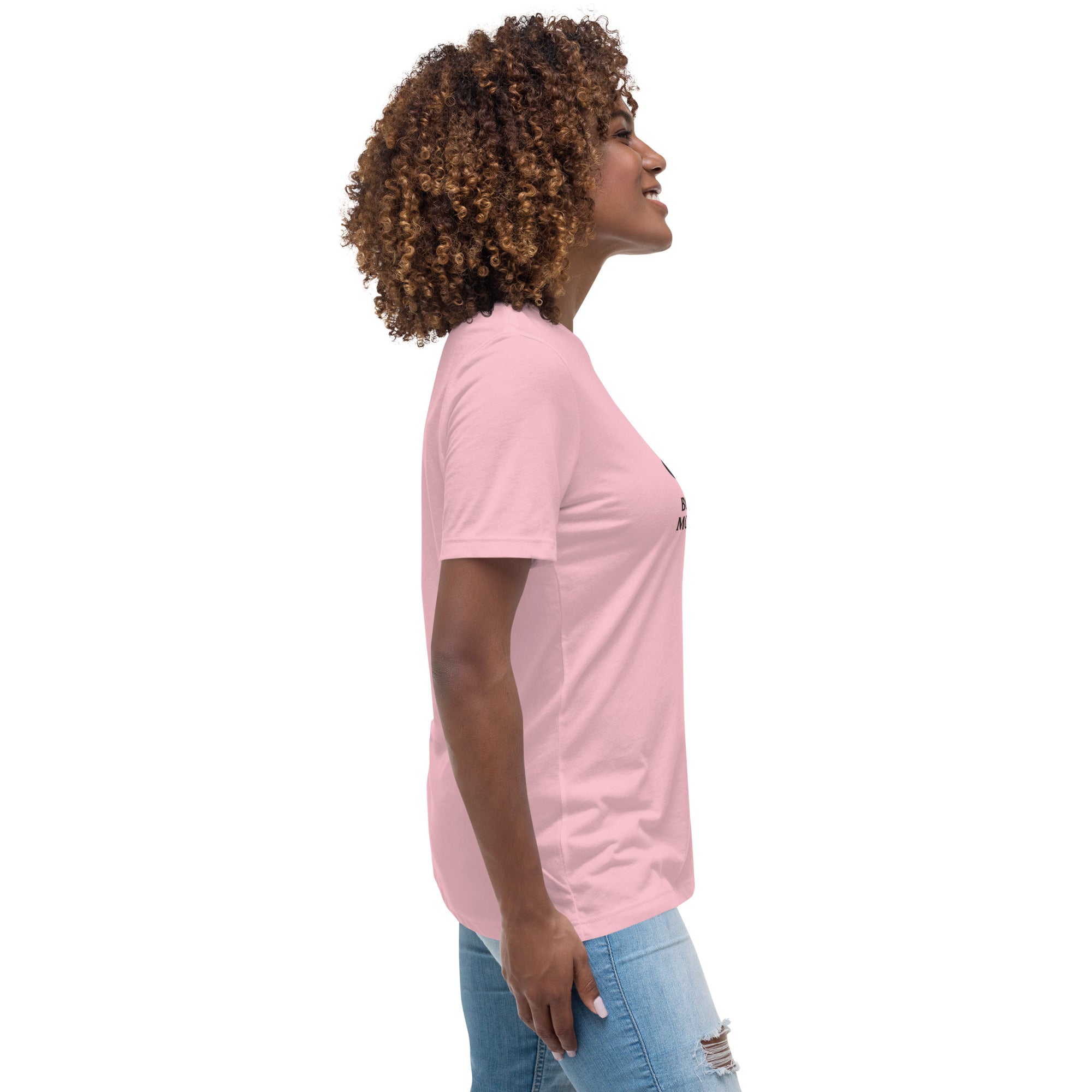 Woman wearing a pink t-shirt and blue jeans on a white background